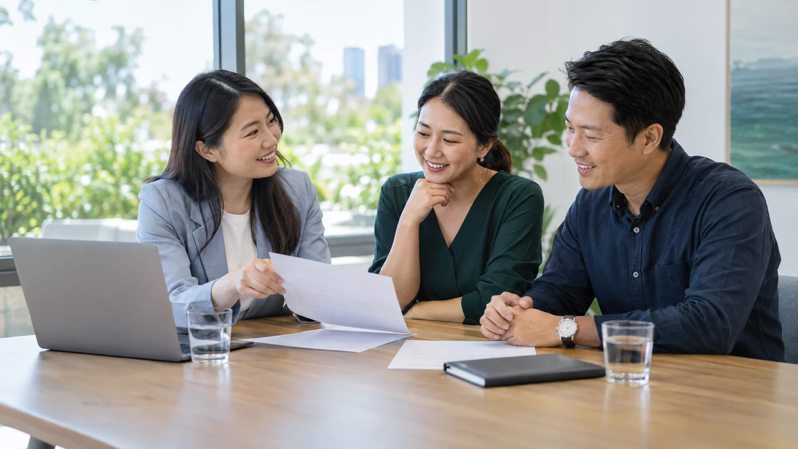People reviewing documents together during a consultation (illustrative scene)